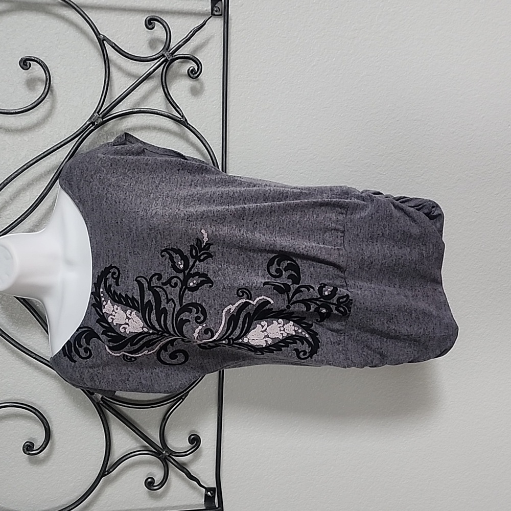 Tunic with scroll accents